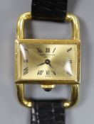 A lady's modern 750 yellow metal Baume & Mercier manual wind rectangular dress wrist watch, on a