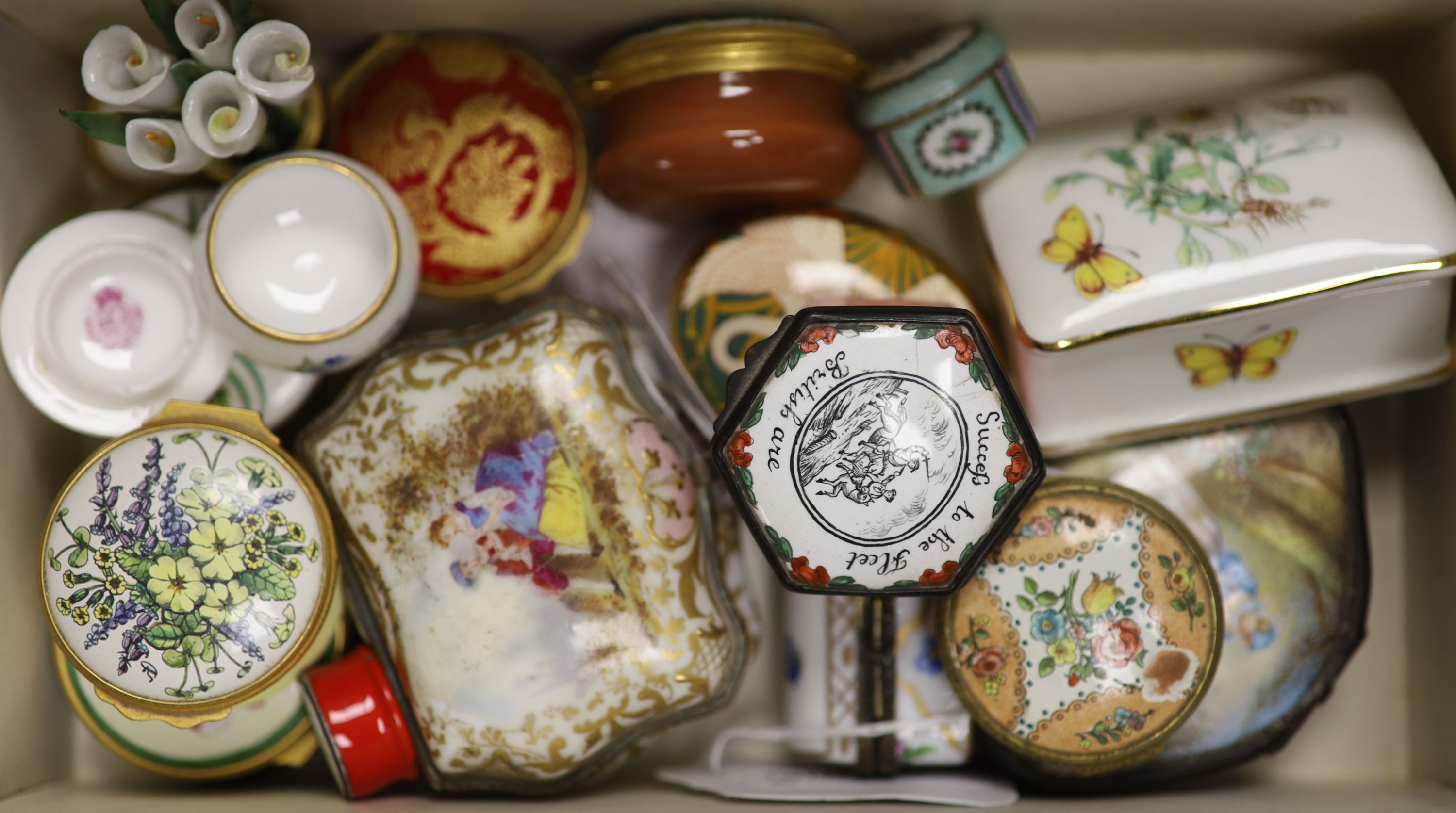 A collection of Continental and other porcelain or enamelled patch boxes, various