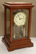 An early 20th century mahogany cased electric four glass mantel clock, height 31cm