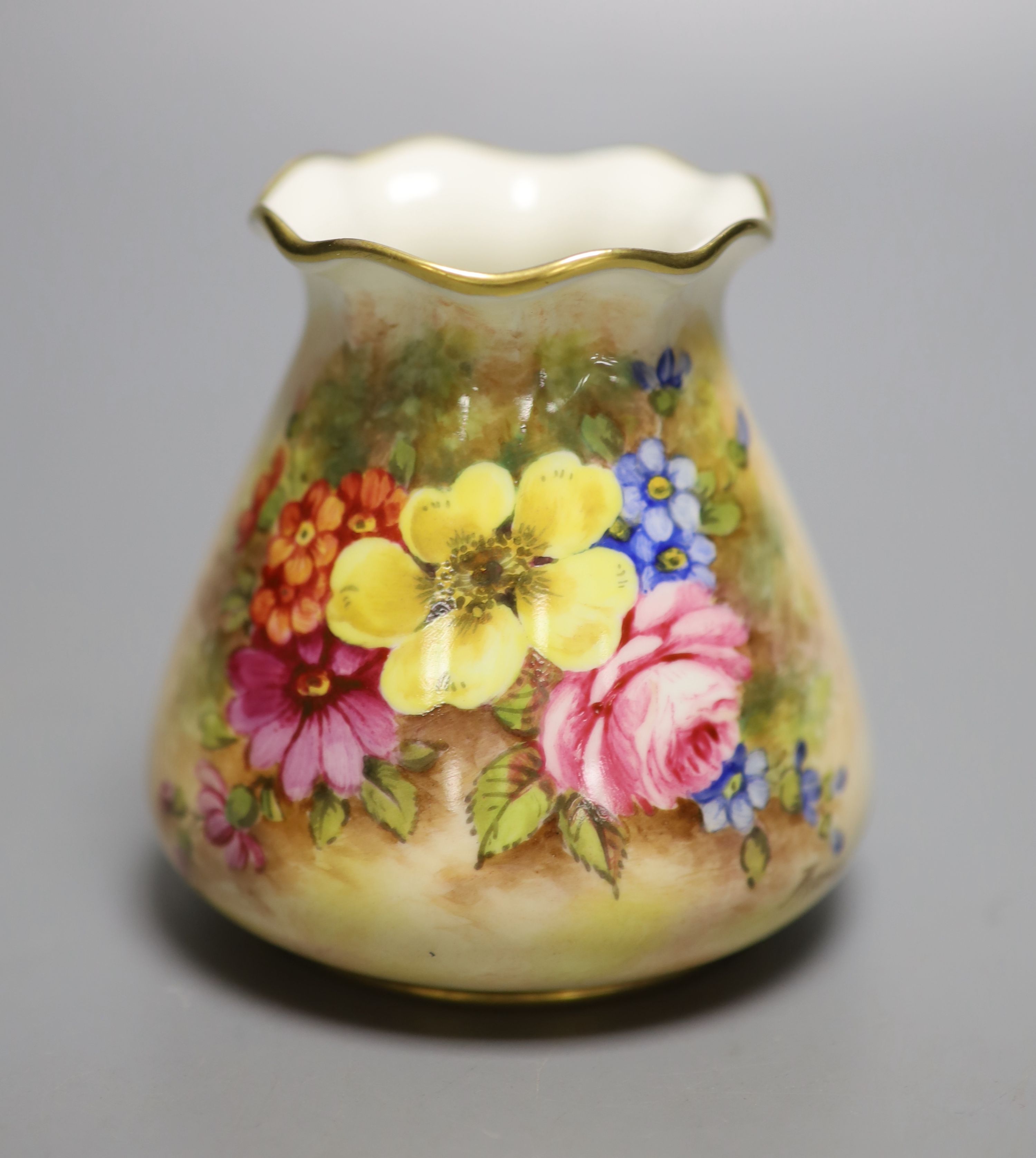 A Royal Worcester sack shape vase, with pie crust rim, painted with a fine floral study by J