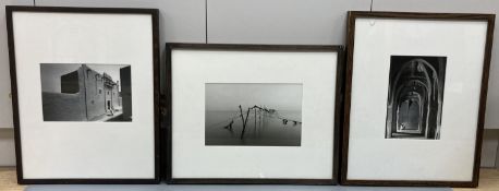 Three framed black and white photographs, North African mosque, Street scene and Fish traps, largest