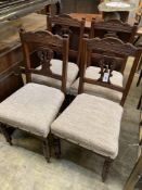 A set of four late Victorian walnut dining chairs