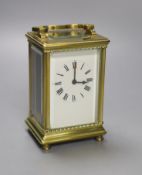 A French brass-cased carriage timepiece, height 10.5cm with handle down