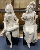 A pair of resin marble seated figures of a Dandy and a Dandizette on ebonised plinthsCONDITION: