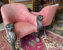 A pair of Empire style upholstered armchairs in the manner of Thomas Hope with leopard's head