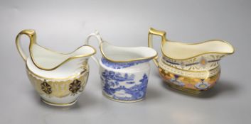 A Coalport hybrid hard paste cream jug in blue and gilt, a Miles Mason blue and gilt cream jug,