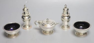 A modern silver five piece condiment set including one spoon, by William Comyns & Sons Ltd,