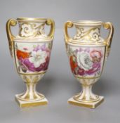 A pair of Regency porcelain two handled vases, painted with flowers, height 19cm