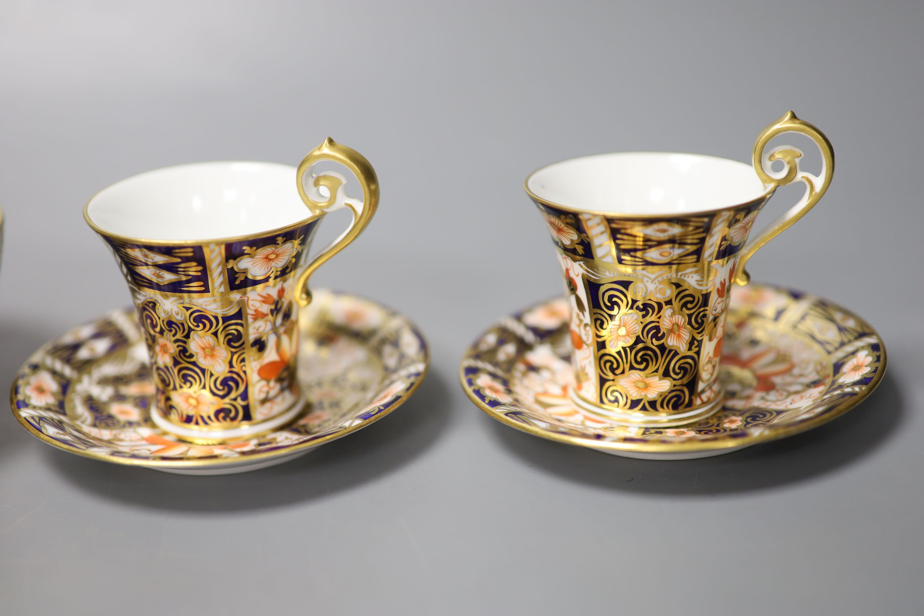 A pair of Royal Crown Derby coffee cups, imari pattern 2451, a coffee can and saucer and a sugar - Image 4 of 7