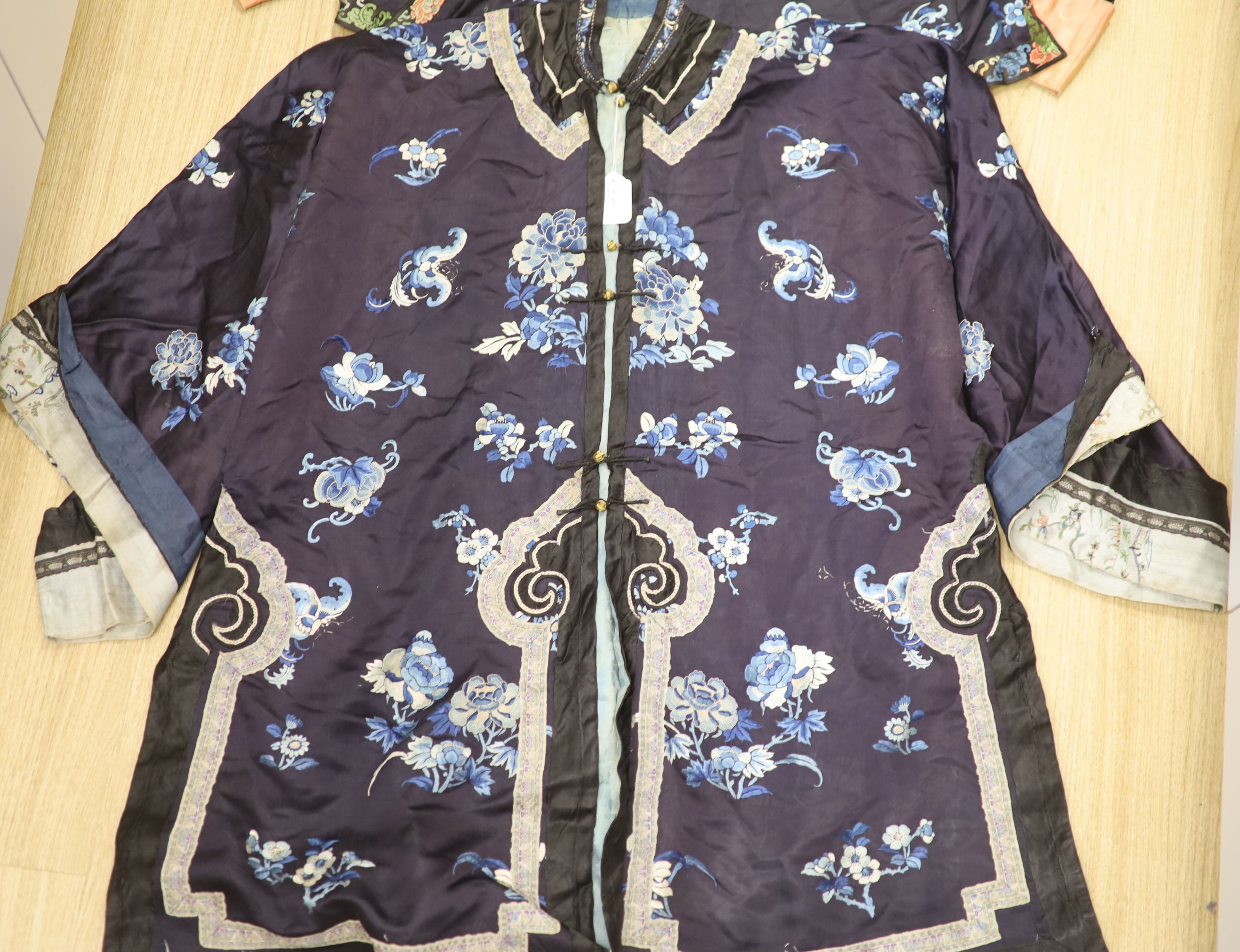 Two Chinese early 20th century embroidered silk jackets, each worked with blue and white peonies and - Image 2 of 8