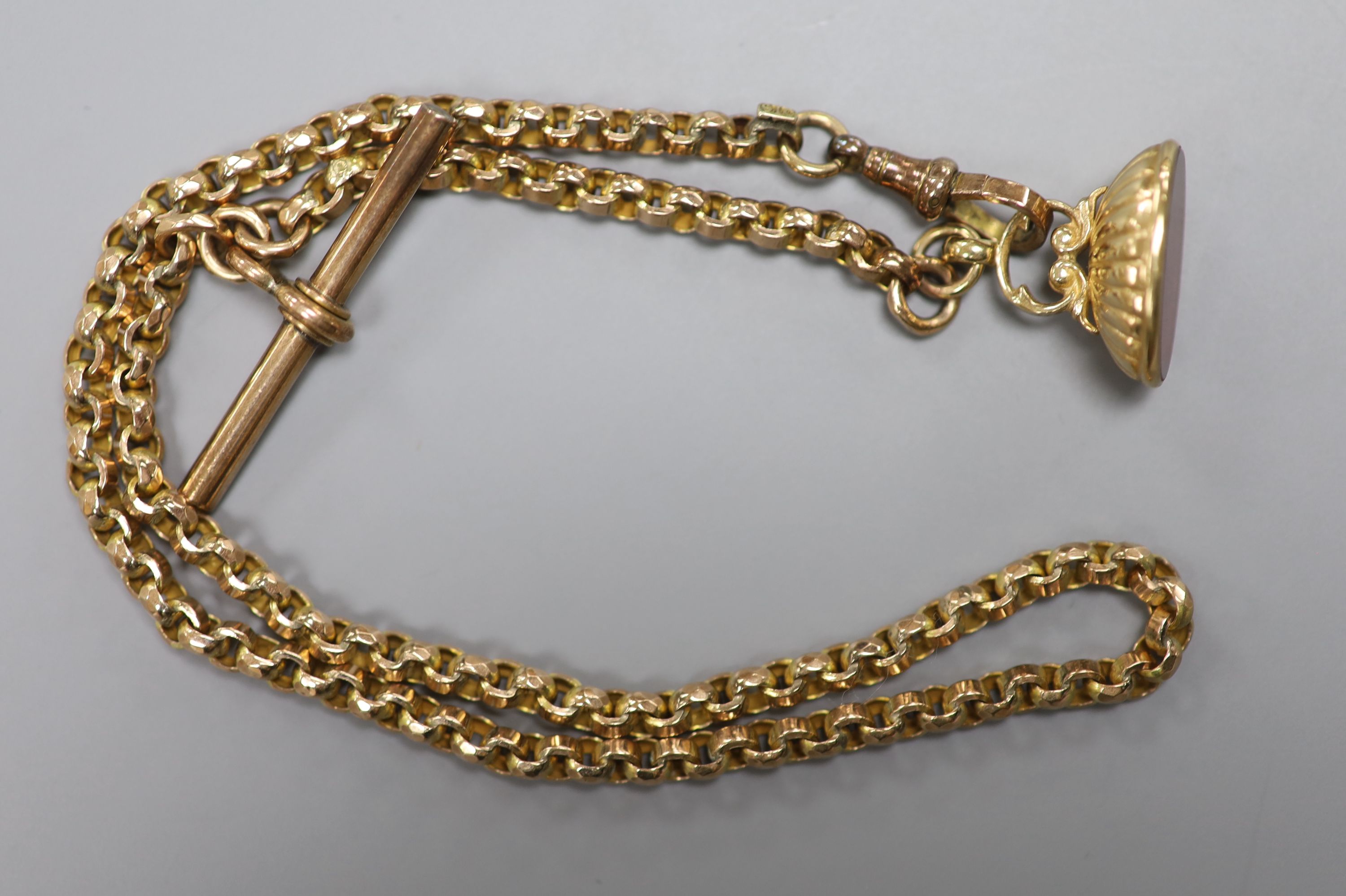 A late Victorian yellow metal (stamped 9c) albert chain, hung with a modern 9ct gold and