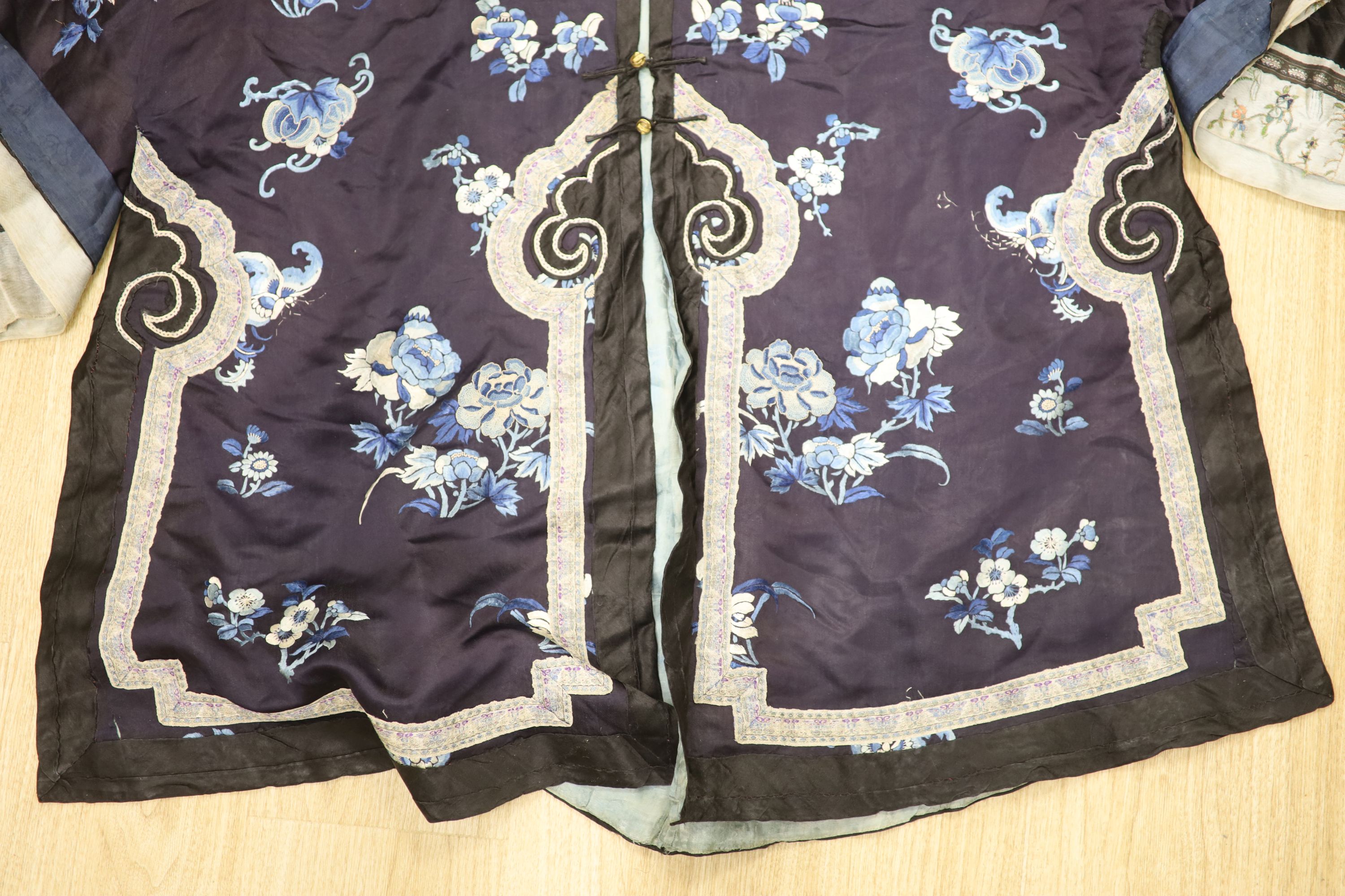 Two Chinese early 20th century embroidered silk jackets, each worked with blue and white peonies and - Image 3 of 8