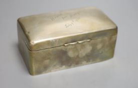 An Edwardian silver rectangular cigarette box, with engraved inscription, A & J Zimmerman,