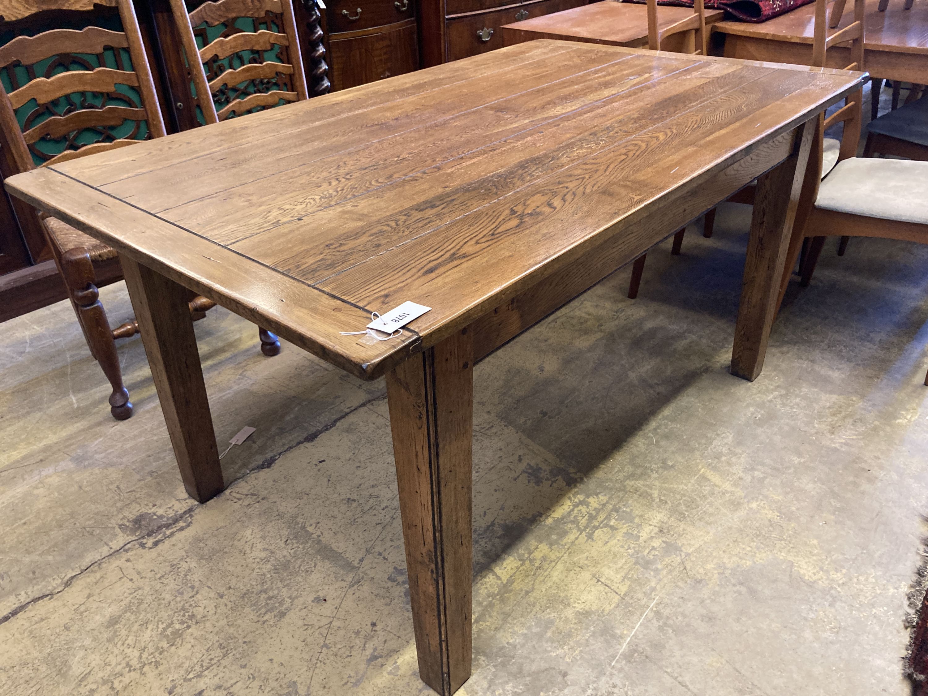A 19th century style rectangular oak dining table with planked top, length 153cm, depth 90cm, height