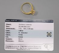 A yellow metal and solitaire diamond ring, with accompanying GCS report dated 8/3/2021, stating