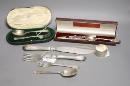 A small collection of silver and plated flatware, comprising a matched three-piece silver