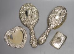 A silver cigarette case, a late Victorian silver heart shaped dish, a silver hand mirror and brush.