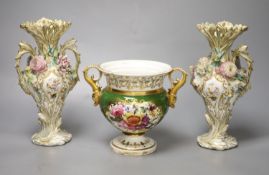 An English porcelain two handled green ground vase and a pair of floral encrusted vases, 20cm