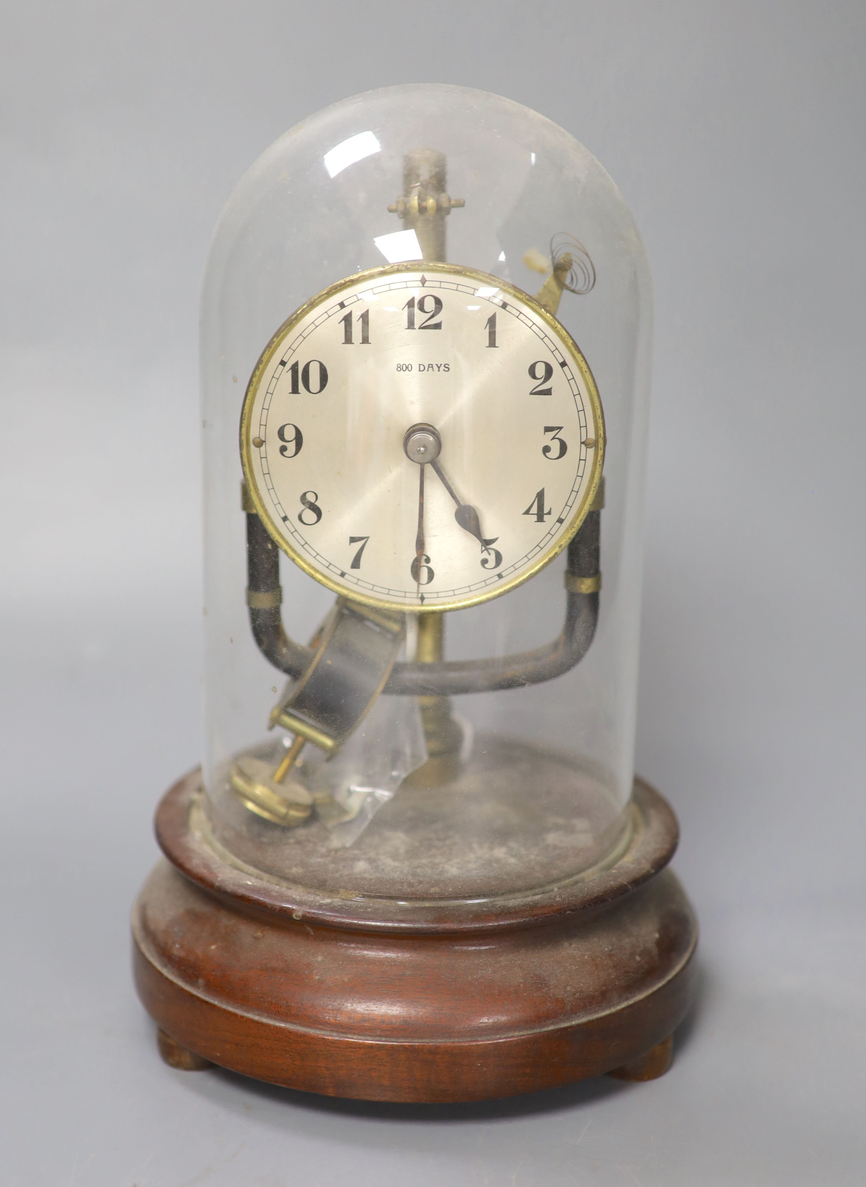 A Bulle electric mantel clock, under a glass dome, 25cm high