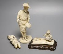 A Japanese Meiji period sectional carved ivory of a man, height 23cm and a Meiji ivory group (