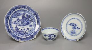 A Chinese 18th century Nanking Cargo blue and white tea bowl and saucer and a small blue and white