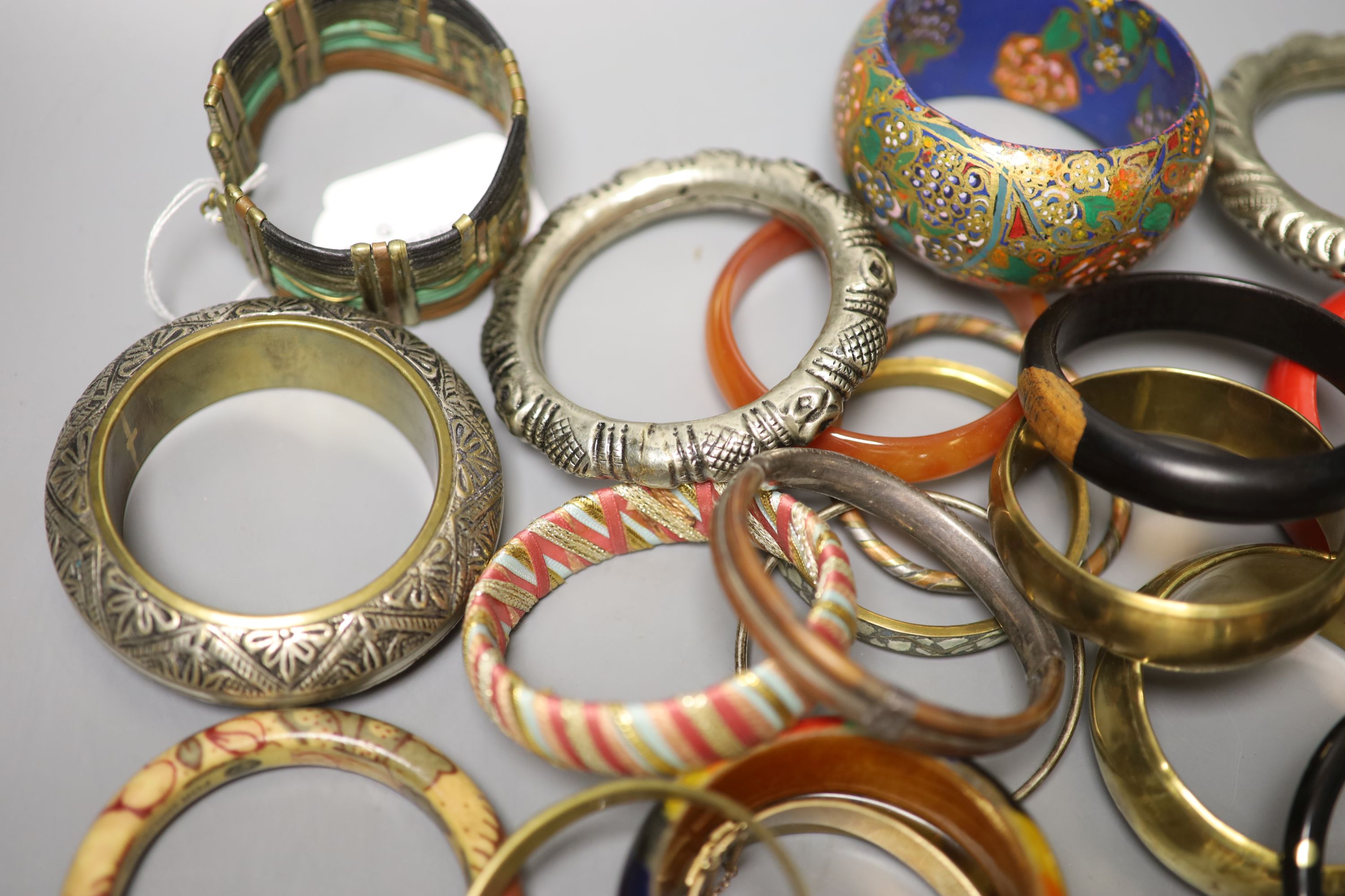 A collection of bangles, including five ethnic white metal examples, a faux tortoiseshell bangle - Image 5 of 5