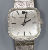 A lady's stainless steel Girard Perregaux manual wind wrist watch, on a textured white gold plated