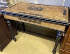 A 19th century Italian inlaid walnut and ebonised card table with folding top (faults), width