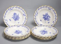 A set of eight Copenhagen plates, painted with flowers in underglaze blue surrounded by a pierced