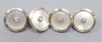 A pair of yellow metal, mother of pearl and diamond disc cufflinks, diameter 14mm, gross weight 8.