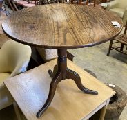 A George III circular oak tea table on tripod base, height 68cm, 78cm diameter