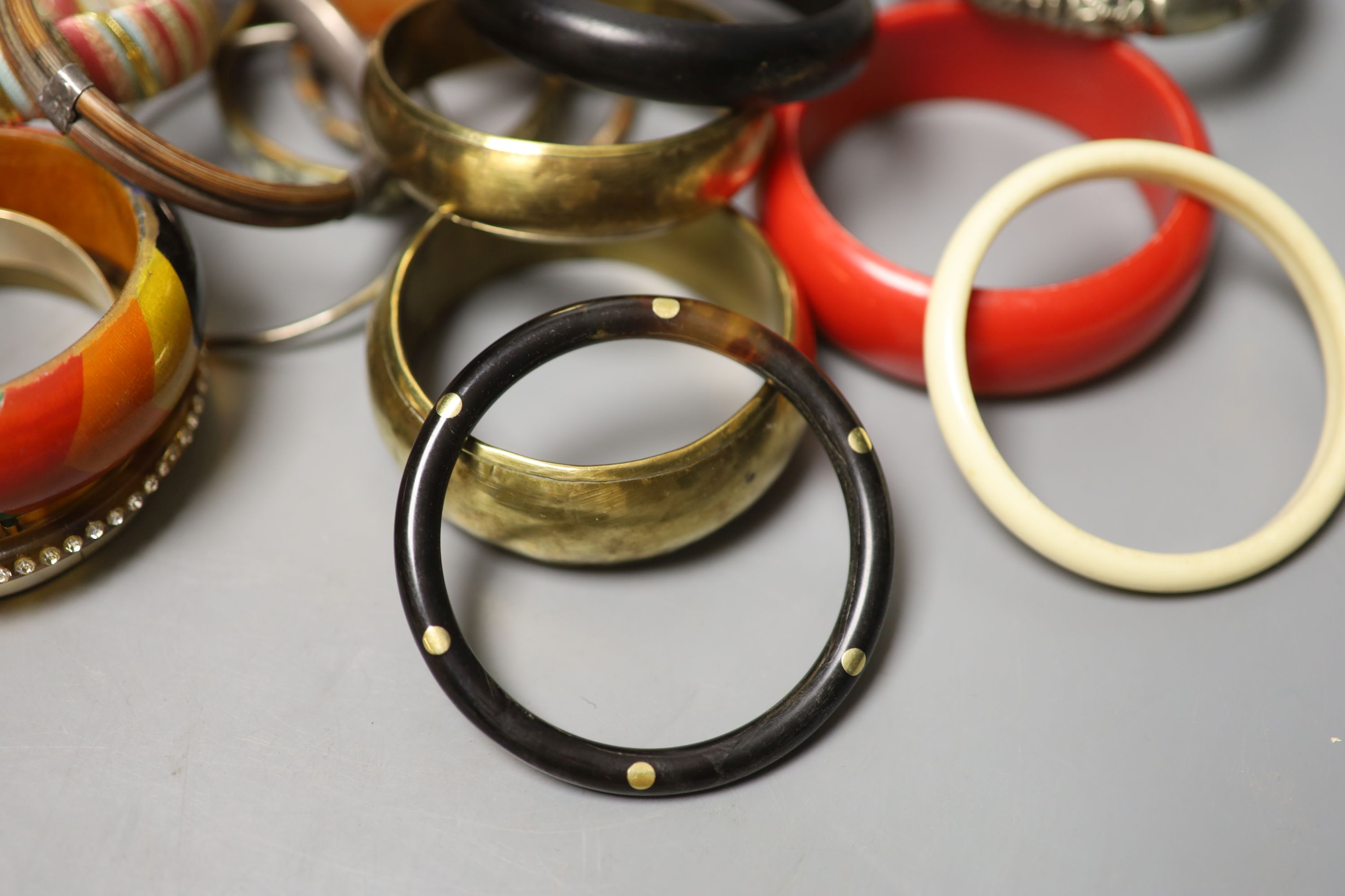 A collection of bangles, including five ethnic white metal examples, a faux tortoiseshell bangle - Image 3 of 5