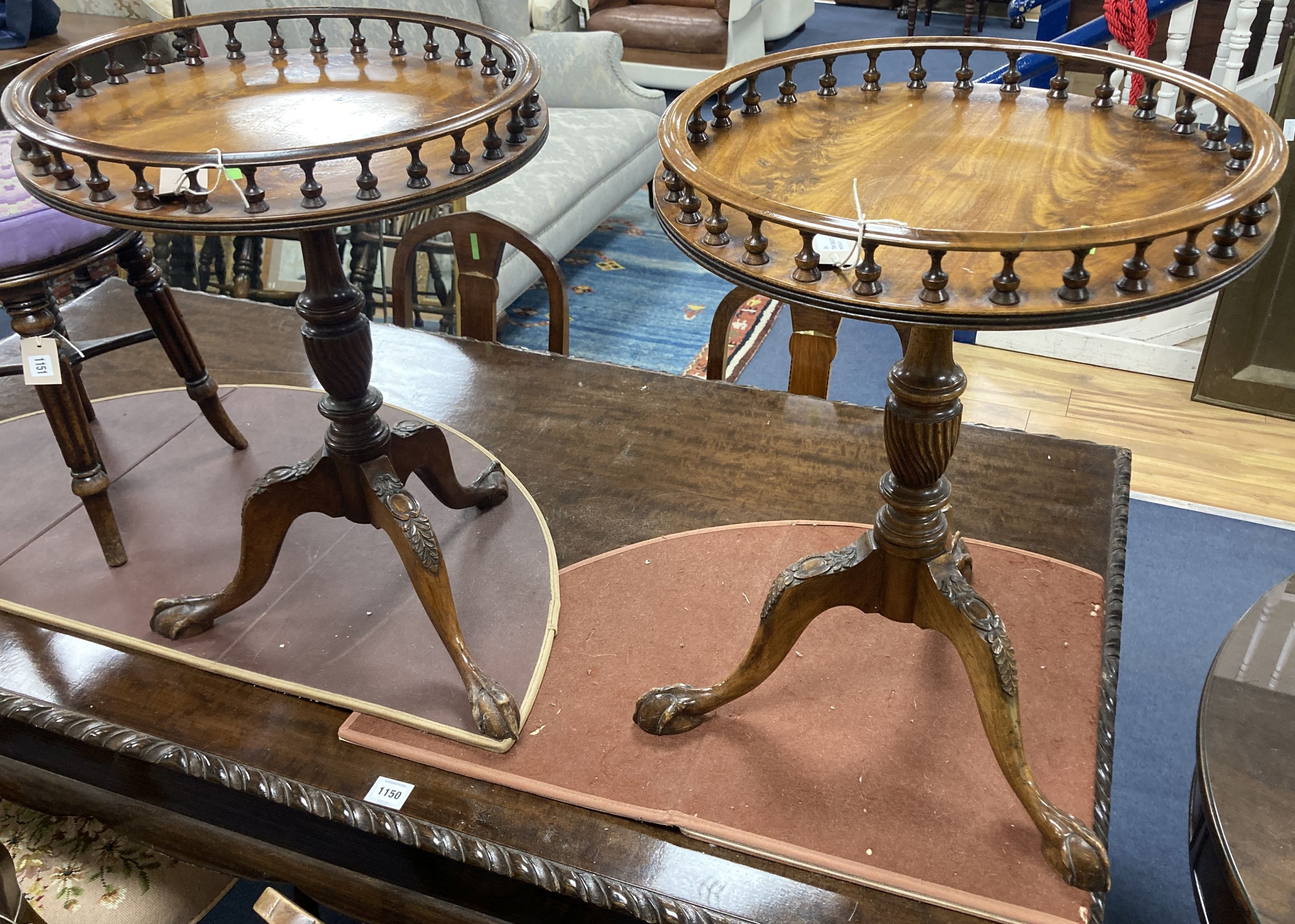 A pair of reproduction George III style mahogany galleried tripod wine tables, 48cm diameter, height