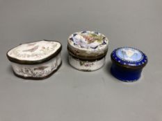An 18th century white enamelled box painted with a palace, 5cm., a cartouche shaped box decorated