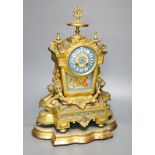 A French gilt metal and Sevres style porcelain mounted mantel clock, on plinth, with key and
