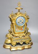 A French gilt metal and Sevres style porcelain mounted mantel clock, on plinth, with key and