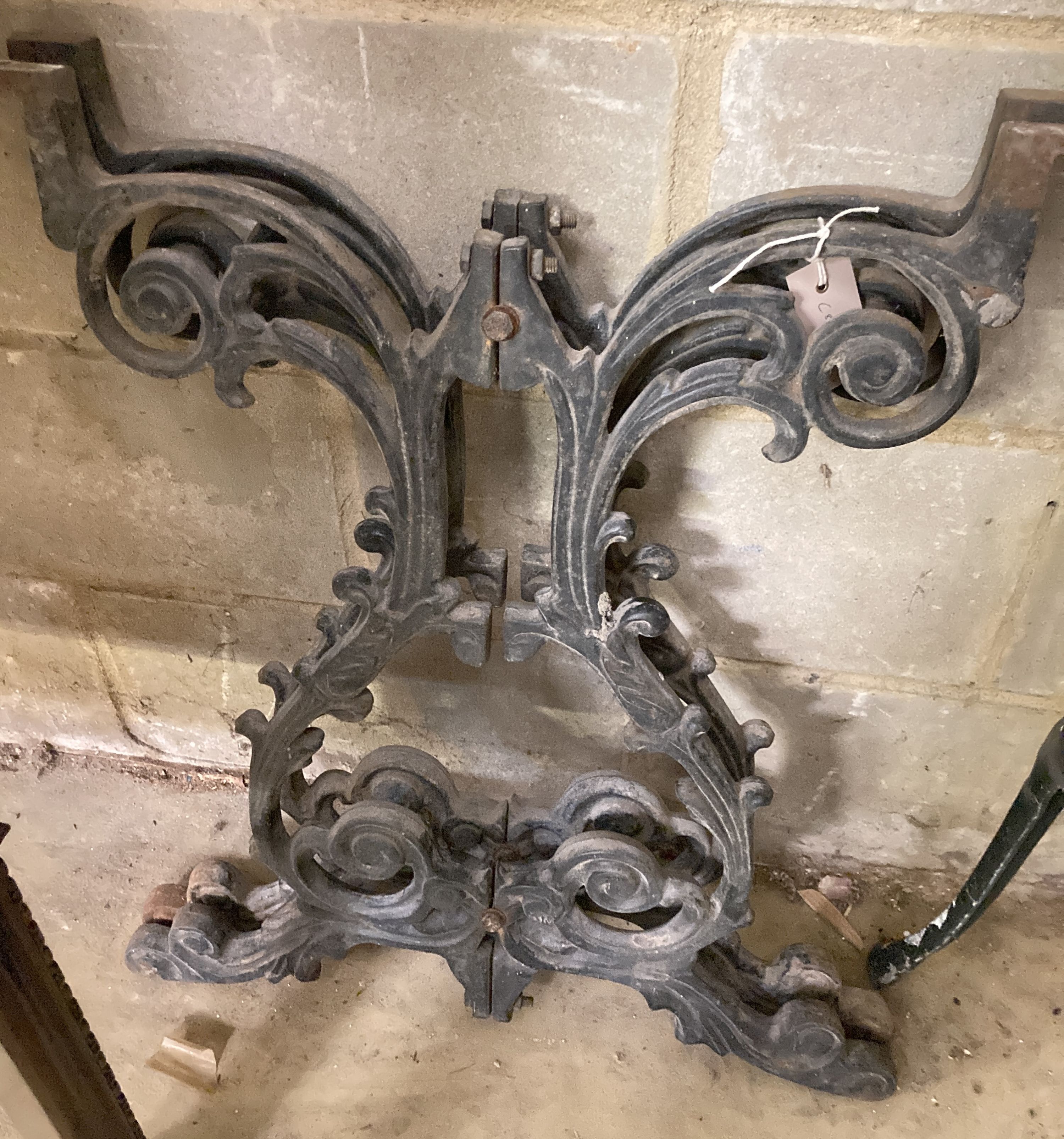 A pair of Victorian style cast iron table supports, width 54cm, height 68cm