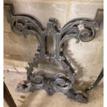 A pair of Victorian style cast iron table supports, width 54cm, height 68cm