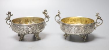 A pair of Italian white metal two handled sweetmeat bowls, by G Accarisi, with figural handles, dia.