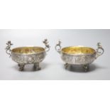 A pair of Italian white metal two handled sweetmeat bowls, by G Accarisi, with figural handles, dia.