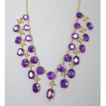 A 19th century gilt metal and oval cut amethyst set drop fringe necklace, 46cm (drop missing from