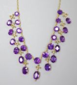 A 19th century gilt metal and oval cut amethyst set drop fringe necklace, 46cm (drop missing from