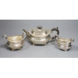 A late Victorian demi fluted silver three piece tea set, Charles Stuart Harris, London, 1899,