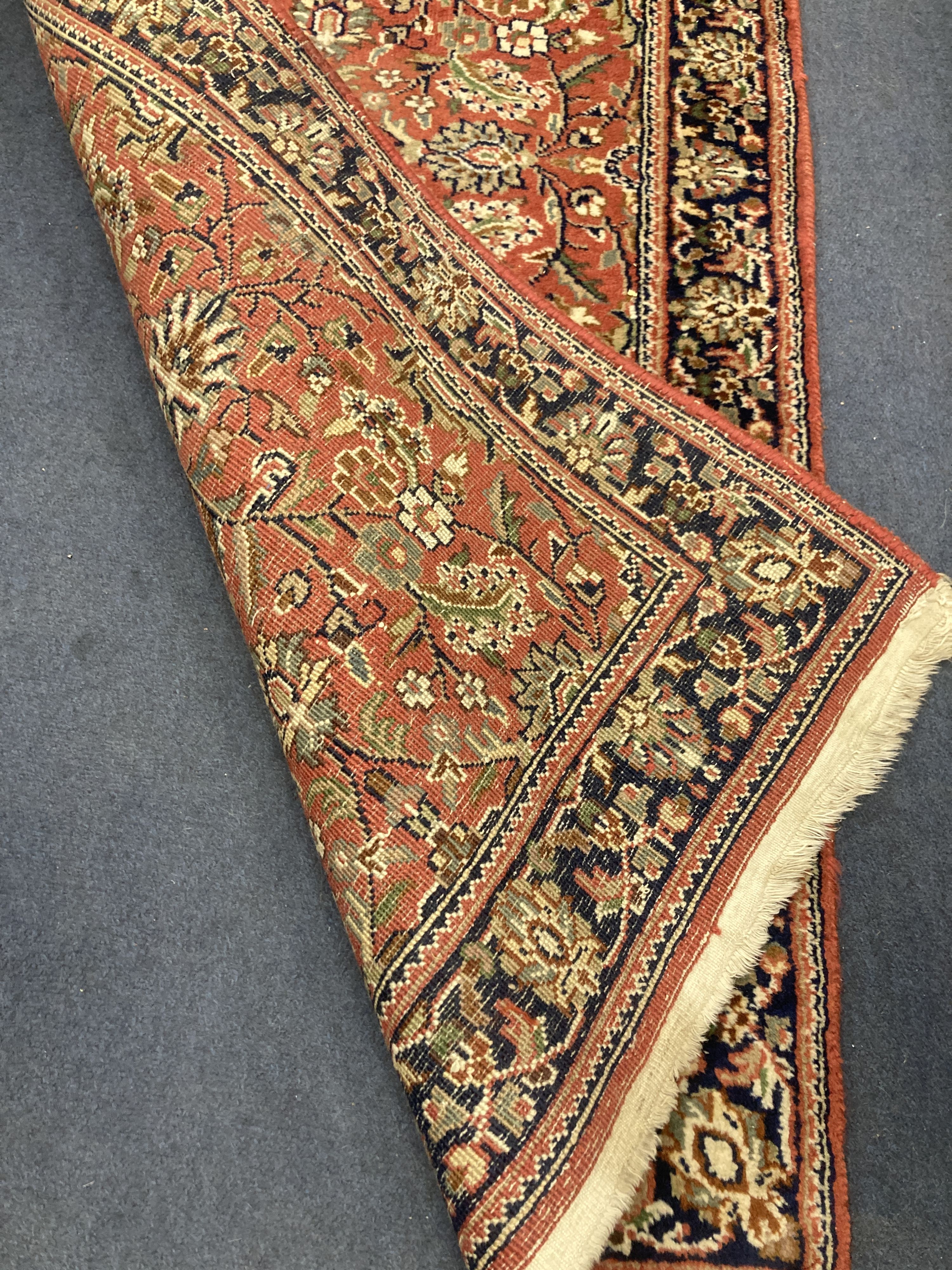 A Persian burgundy red ground rug, 146 x 69cm - Image 2 of 2