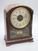 A Bulle mahogany mantel clock, with laurel wreath carving to the arched top, height 32cm