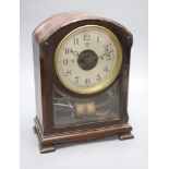 A Bulle mahogany mantel clock, with laurel wreath carving to the arched top, height 32cm