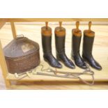 Two pairs of riding boots and trees together with two boot pulls and riding crops and a toleware hat