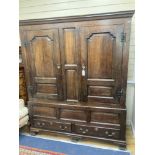 A mid 18th century oak panelled two part hanging cupboard, width 156cm, depth 53cm, height 188cm