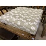 A contemporary Victorian style footstool upholstered in grey / ivory fabric, length 85cm, depth