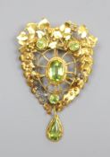 A pierced yellow metal and four stone peridot set brooch(adapted), 52mm, gross 9.7 grams.
